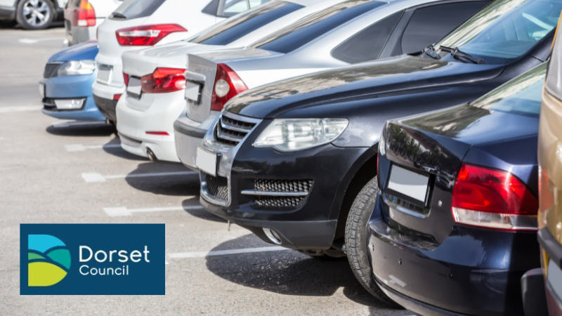 Row of different cars parked in a car park with Dorset Council logo in bottom right corner