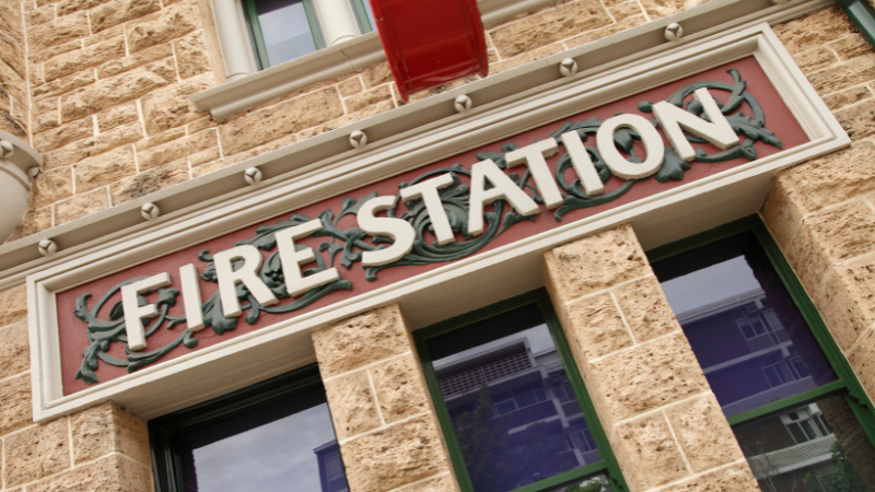 Victorian style fire station sign on stone building