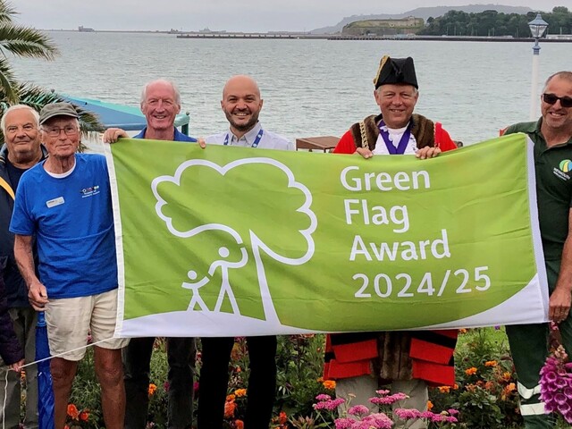 Weymouth Mayor and Town Council staff with Green Flag Award banner