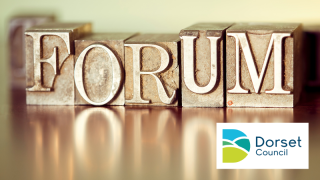 Gold coloured metal printing blocks spelling out the word FORUM with reflection underneath. Dorset Council logo in bottom right corner